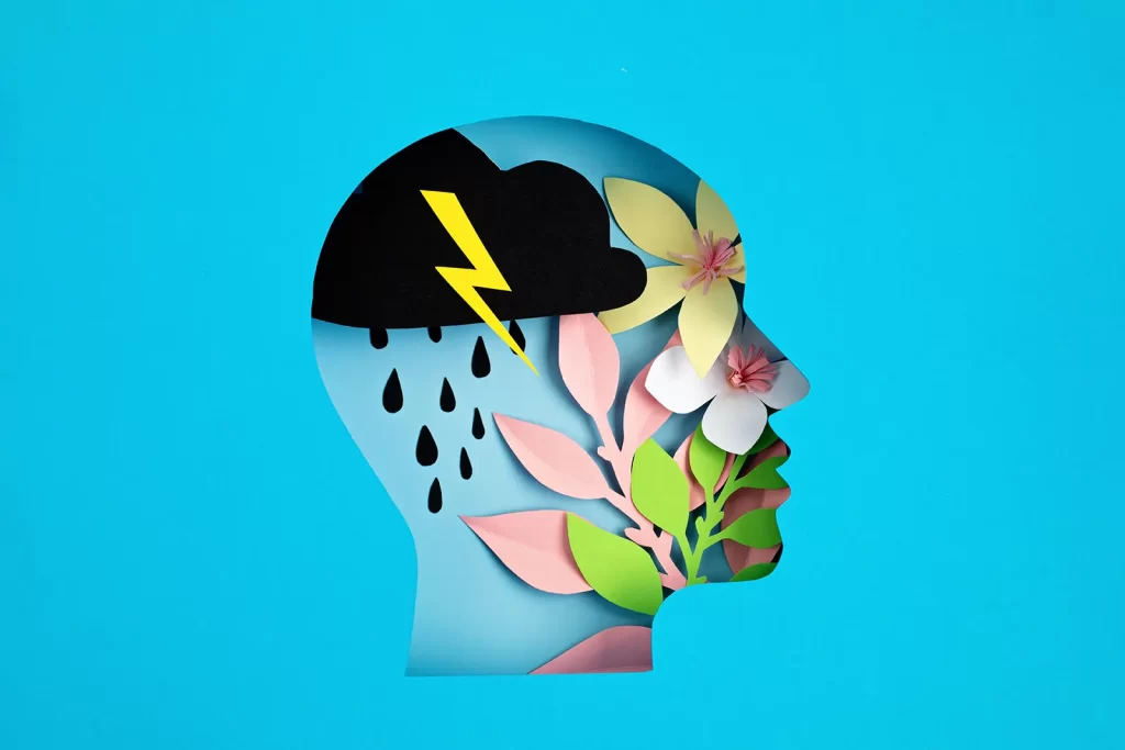 Abstract graphic of human head with flowers, cloud and lightening bolt